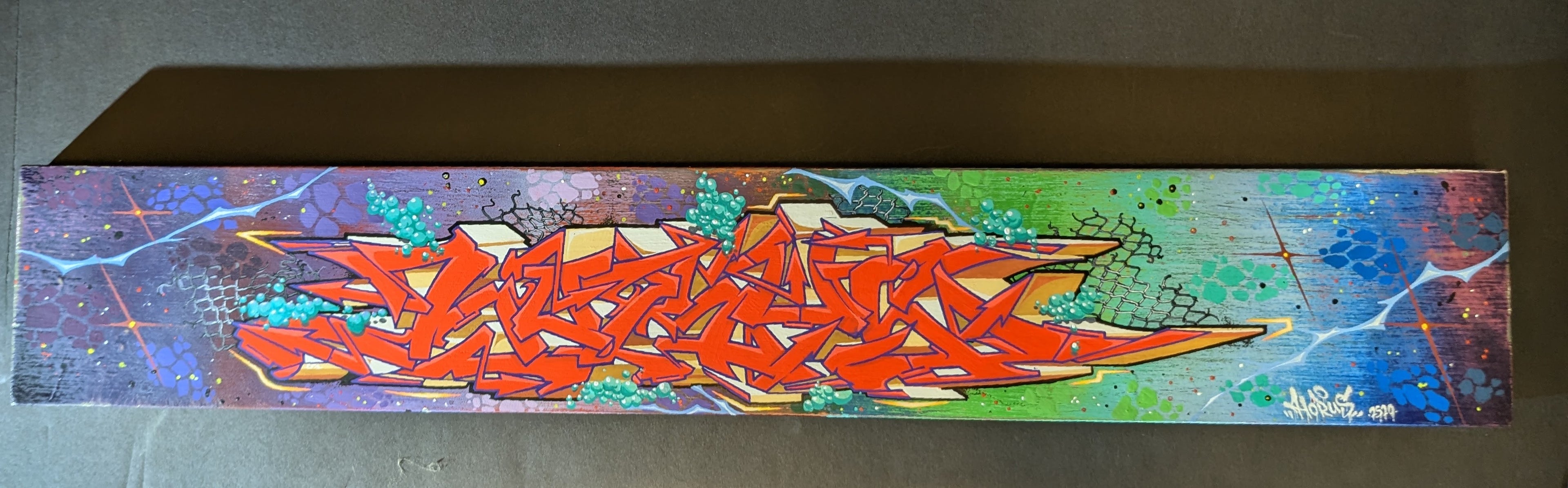Original 6x36 inch panoramic graffiti painting titled "Cosmic Funk" by Horus, featuring abstract lettering, cosmic colors, and vibrant mixed media on a wood panel.