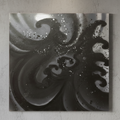 Abstract black and white art on a textured wall