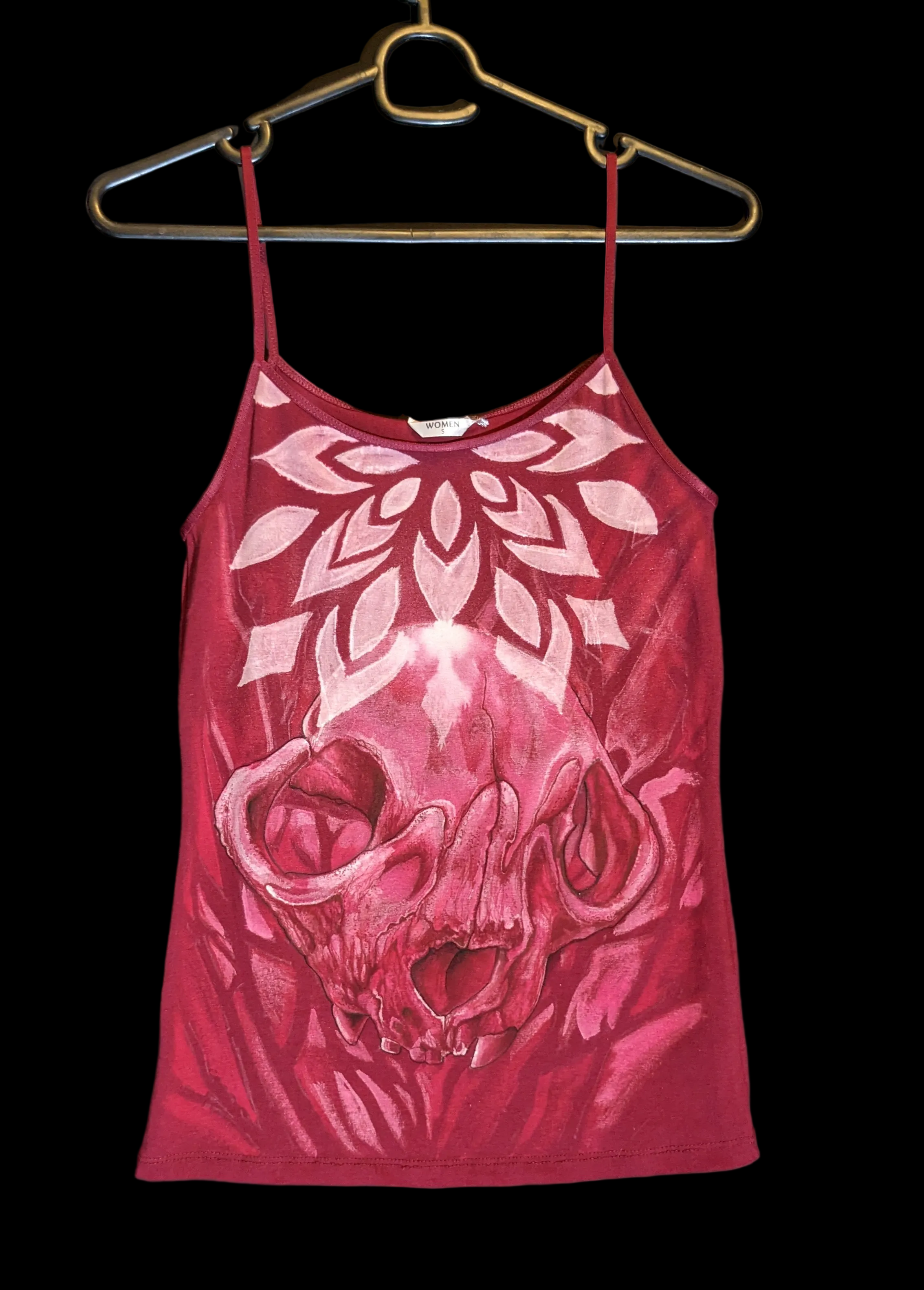 Mandala and skull bleach paint design ona woman’s top